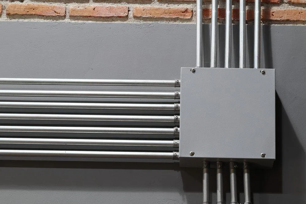 Steel Electrical Conduit Fastened to a Concrete Wall - KrisTech Wire (Photo via Shutterstock)