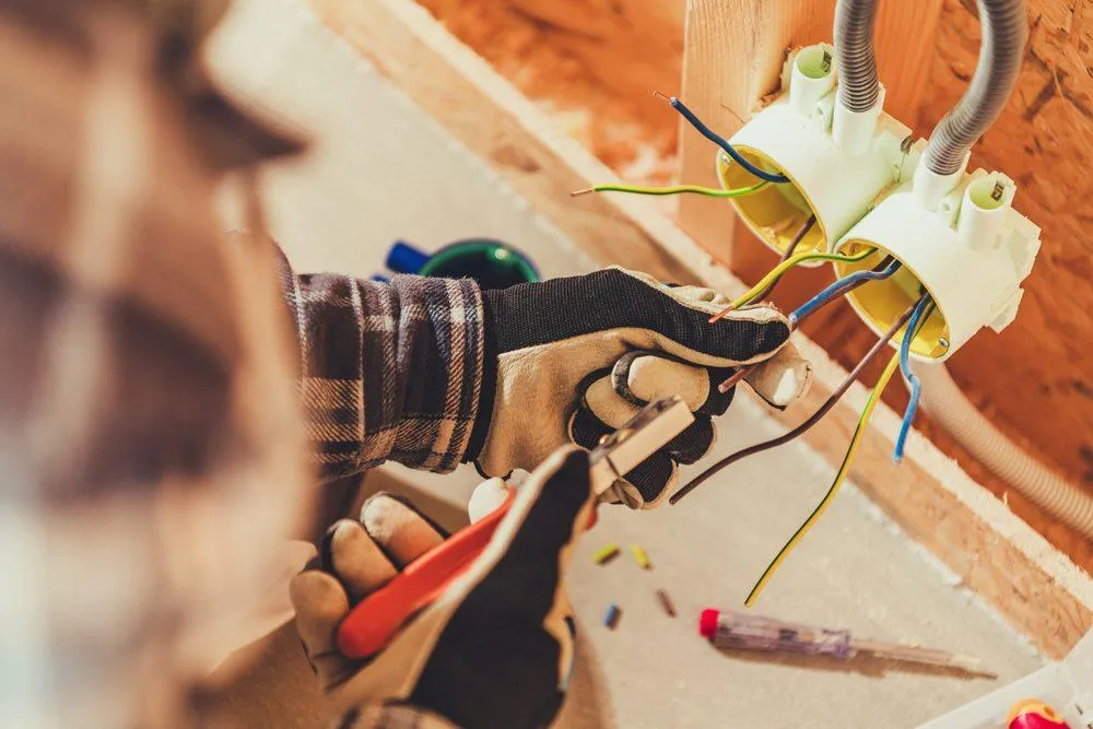 Electrician Working - KrisTech (Photo - Shutterstock)