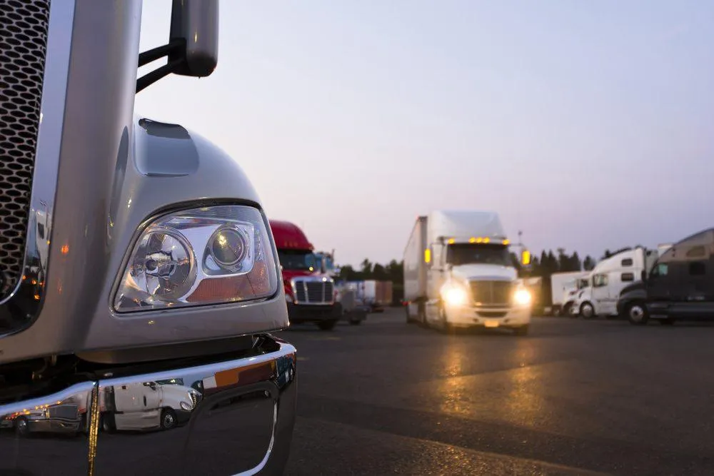 Tractor Trailers in a Parking Lot - KrisTech Wire (photo via Shutterstock)