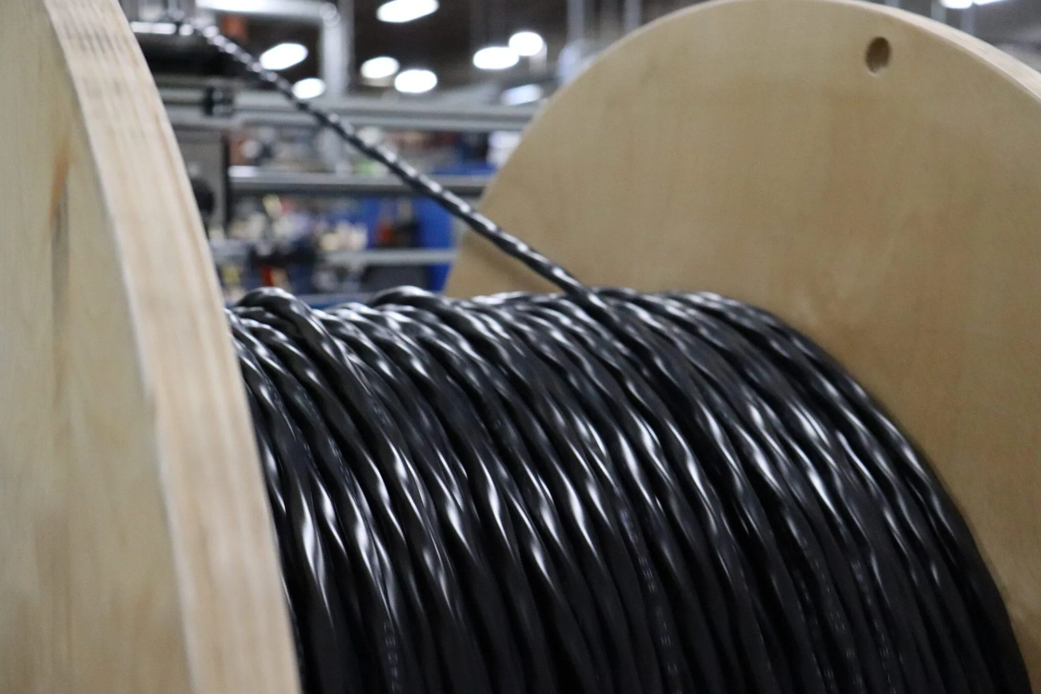 Tray cable coming off the line and loading onto a wooden reel. - KrisTech Wire