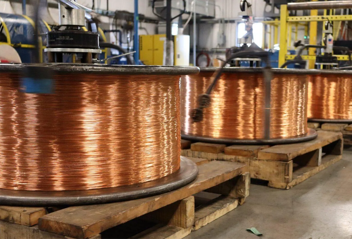 Copper wire on several reels at the KrisTech facility.