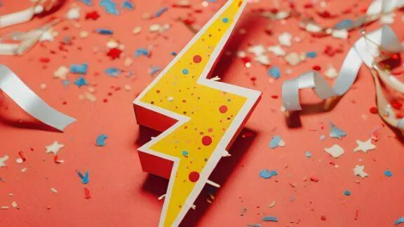 Lightning Bolt on a Red Background with Colored Confetti - KrisTech Wire