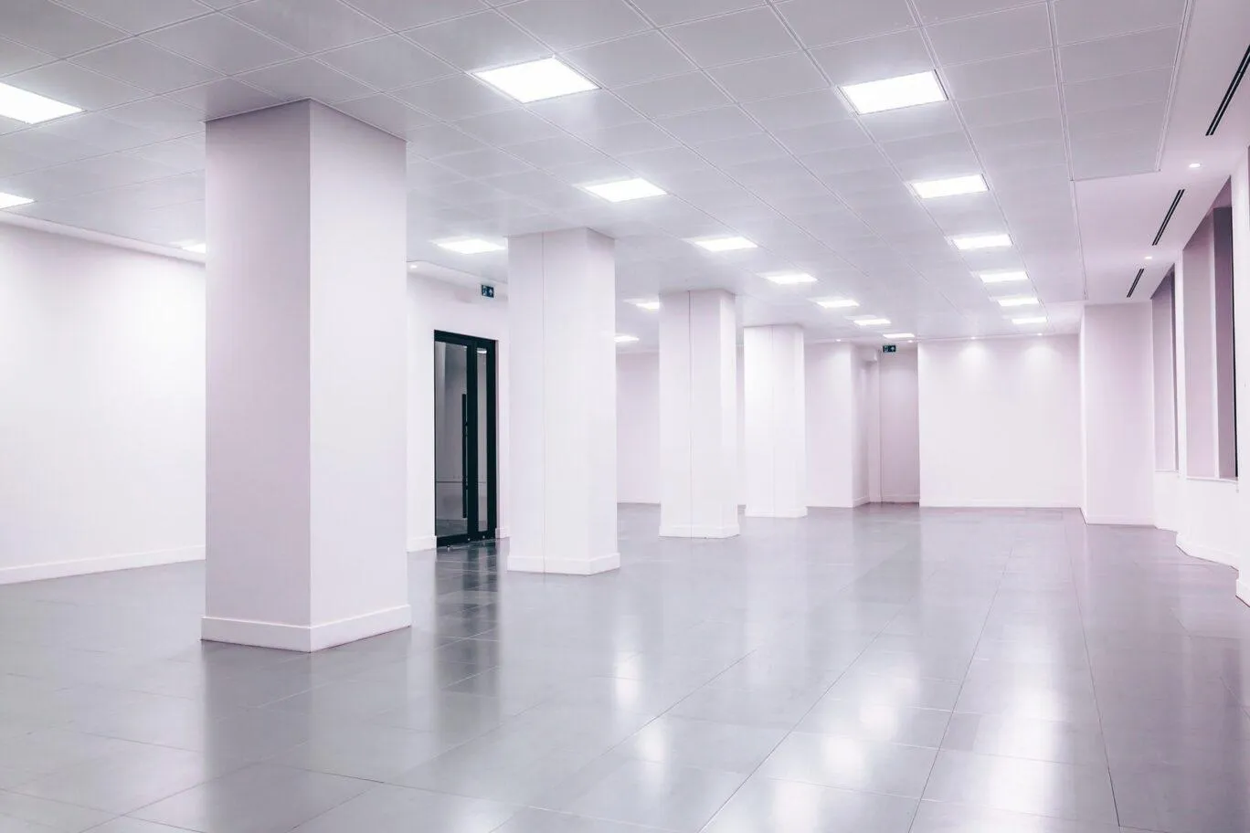 Lighting installed in an empty office building. (Andrea De Santis / Unsplash)