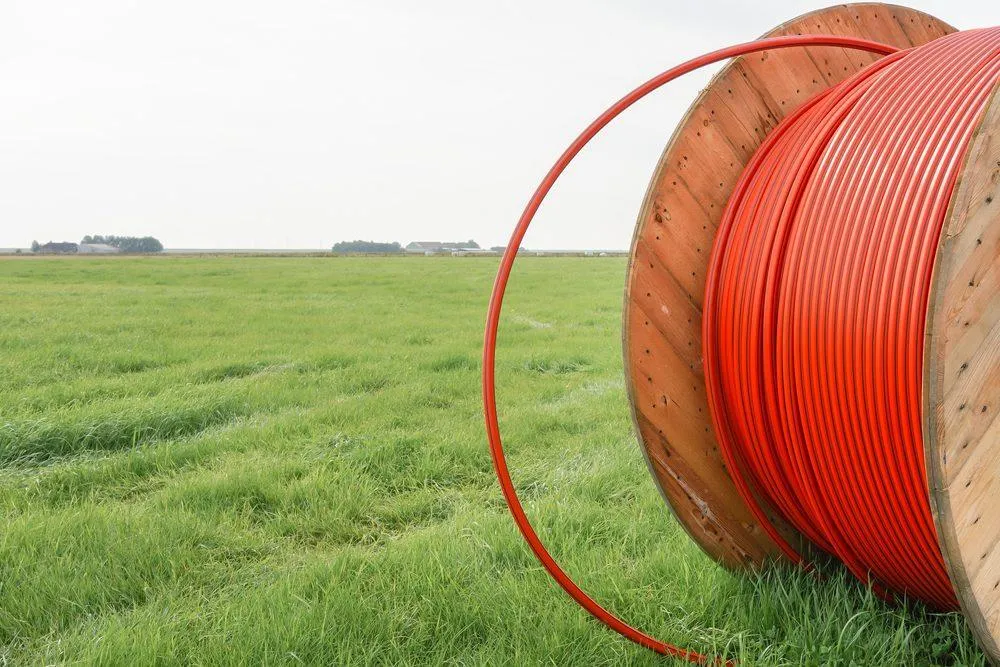 Broadband Cable on a Reel in a Field - KrisTech Wire (Photo via Shutterstock)