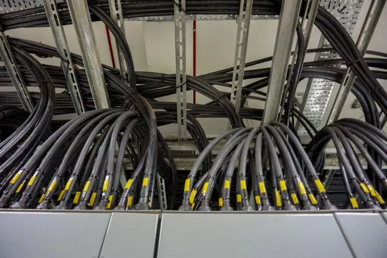 A group of cables is bundled together outside of a metal electrical box. - KrisTech Wire (Photo via Shutterstock)