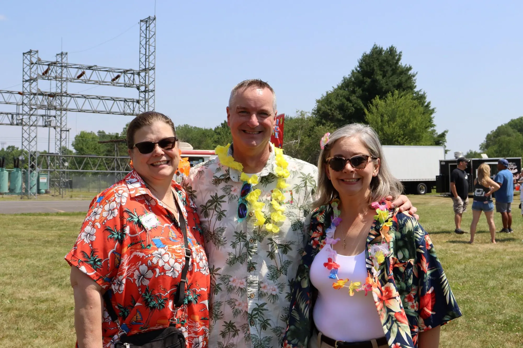 KT employees post for a photograph during the KrisTech Summer Picnic. Photo by Gino Geruntino.