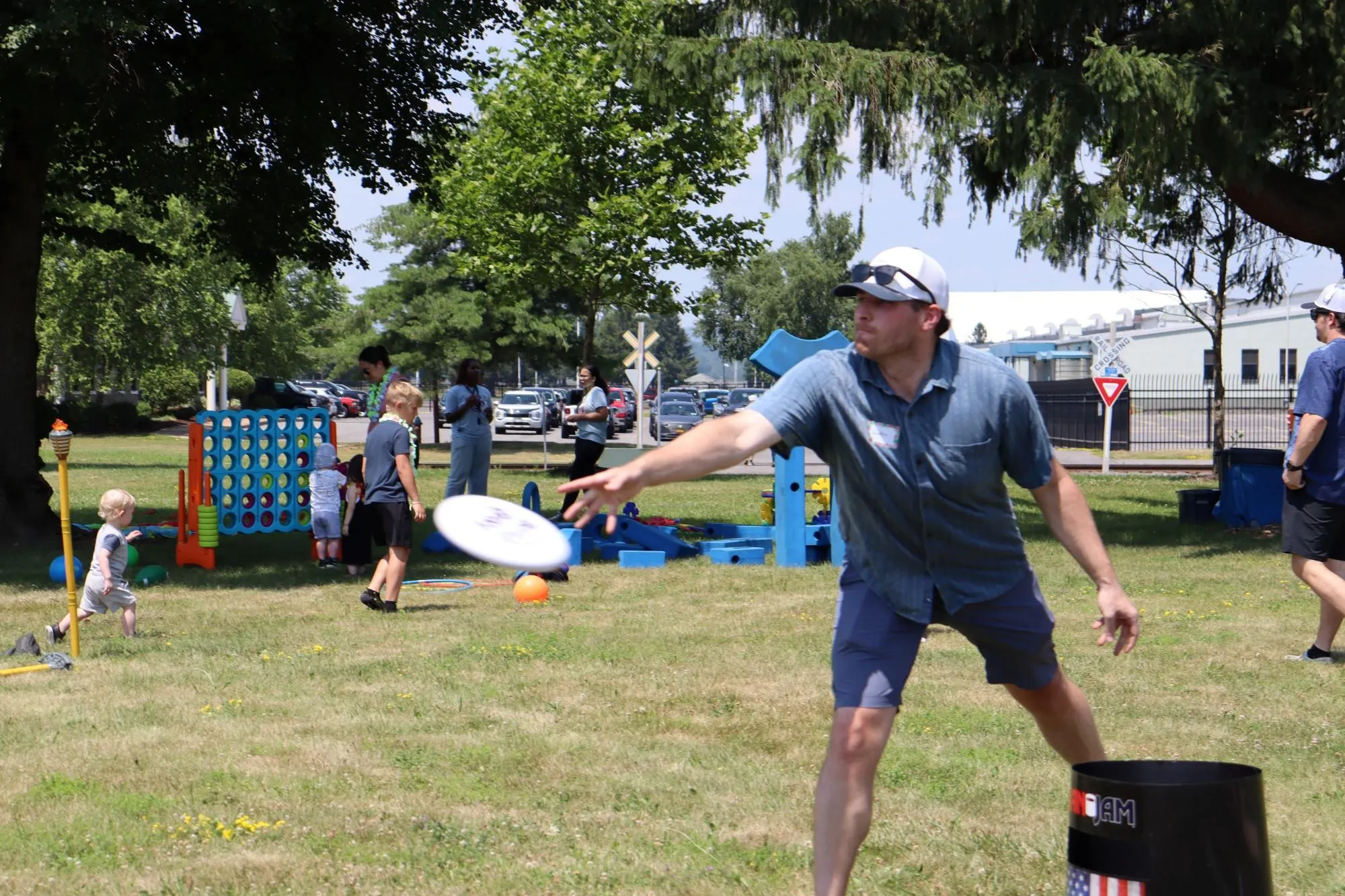 A KrisTech employee throws a frisbee during a game of KanJam at the KT Picnic. Photo by Gino Geruntino.