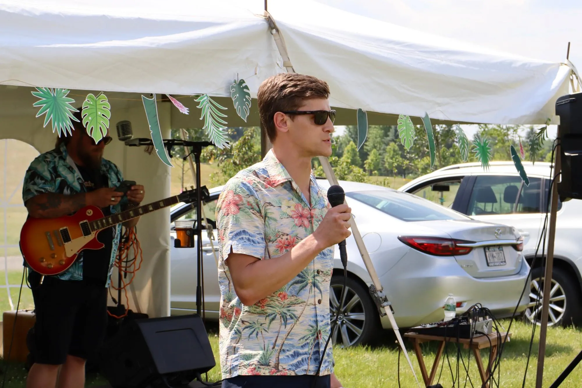 KrisTech President and CEO Graham Brodock addresses the audience during the KrisTech summer picnic. Photo by Gino Geruntino.