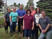KrisTech employees pose for a photo during a recent volunteer project with Rome Clean and Green.
