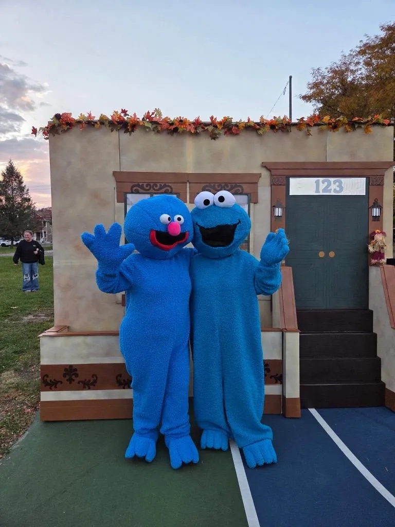 Grover and Cookie Monster, two clue characters on Sesame Street, pose for a photo during Rome's Fright Night at Franklyn Field event.