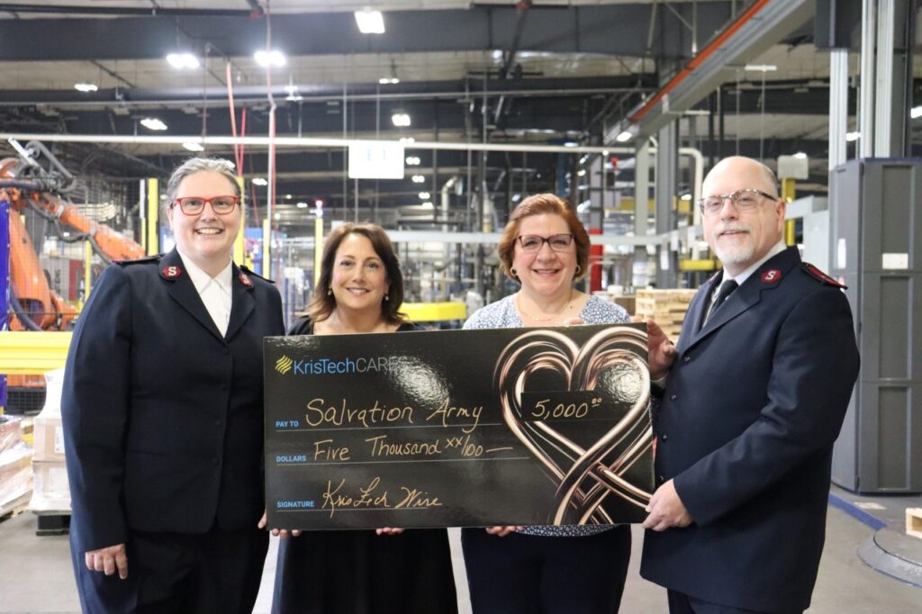 Kris-Tech donated $5,000, food, clothing, and other items to the Salvation Army of Rome.