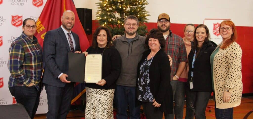 Kris-Tech team members pose with their award.